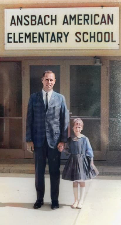 1961 Dad, also the Principal, walking me across the street for my first day of Kindergarten. We lived next to the Elementary School on the Army base