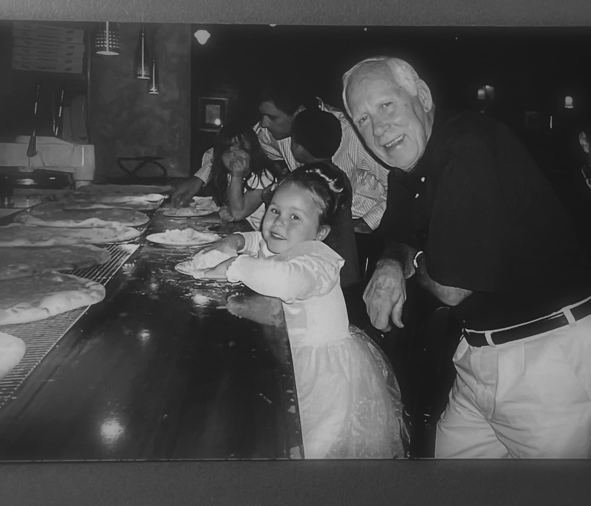 Granddaughter Nicole making pizza with PawPaw